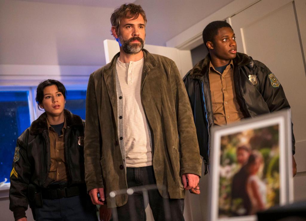 Mya Lowe, Rossif Sutherland, and Fritzy-Klevans Destine as officer Edwina Yen, police chief Karl Alberg, and officer Andy Kendrick in Murder in a Small Town (2024)