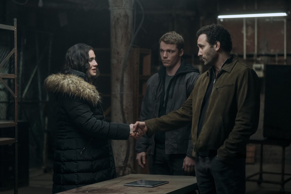 Arienne Mandi as Noor, Gabriel Basso as Peter Sutherland, and Marwan Kenzari as Sami in The Night Agent Season 2.