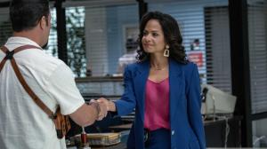 A promotional still from TV series Dexter: Original Sin featuring Christina Milian as Detective Maria LaGuerta shaking the hand of a male detective.