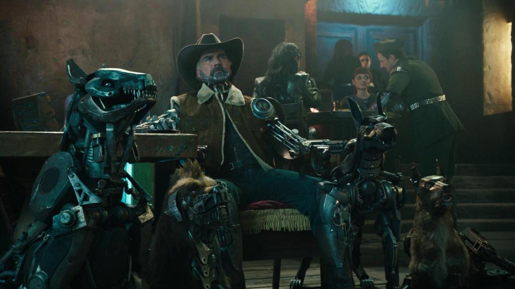 A rugged cyborg man wearing a cowboy hat and a shearling-lined jacket sits confidently in a dimly lit bar, flanked by intimidating robotic dogs. His arms and parts of his body are mechanical, and his expression is stern. Around him, patrons sit and chat in the background, with a dark, industrial sci-fi aesthetic throughout the scene.