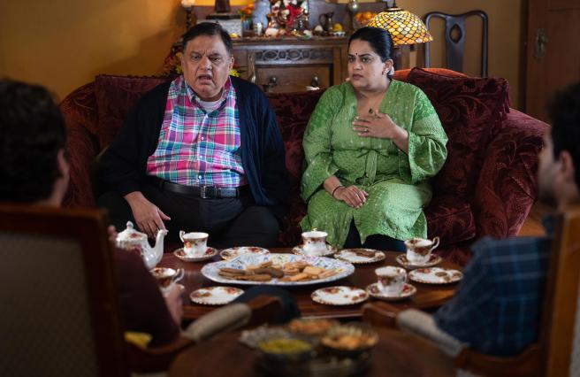 Harish patel and Zarna Garg in A Nice Indian Boy, both are looking shocked and surprised.