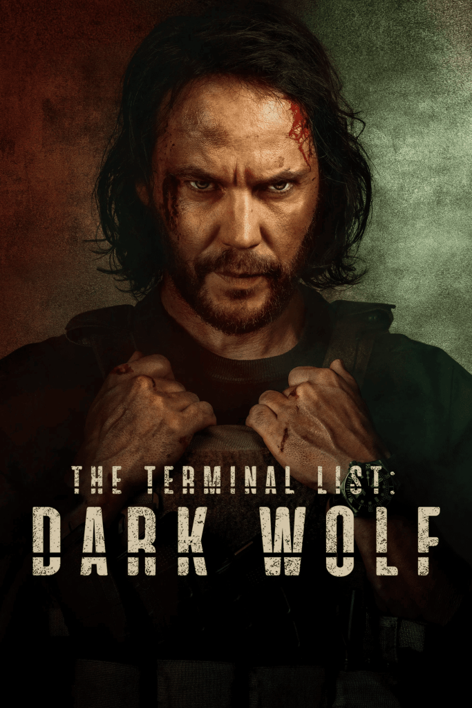 Official promotional poster for the 2025 series "The Terminal List: Dark Wolf" featuring a bearded chin-length dark hair Taylor Kitsch, gripping the front of his bulletproof jacket. His gaze is hard and intense