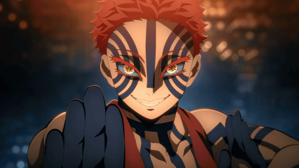 The Upper Rank demon Akaza stands in a martial stance, in a still from Demon Slayer: Kimetsu no Yaiba – Infinity Castle.
