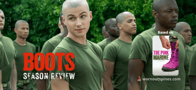 A young Marine recruit with a buzz cut smirks amid a line of stoic fellow trainees in green uniforms, standing in formation outdoors.