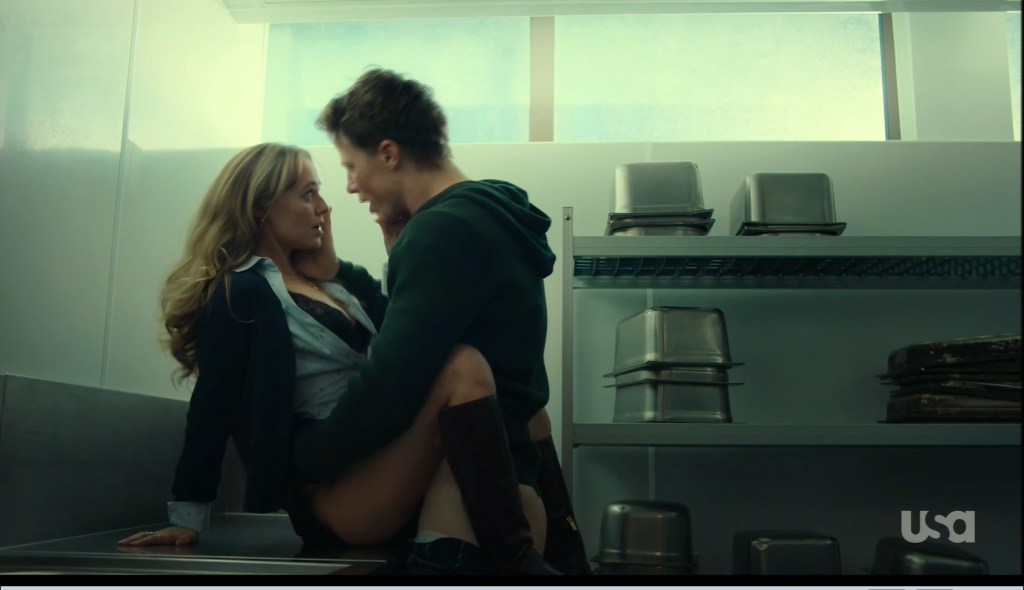 A steamy scene featuring a man and woman on a kitchen counter, smiling and enjoying each other's company.