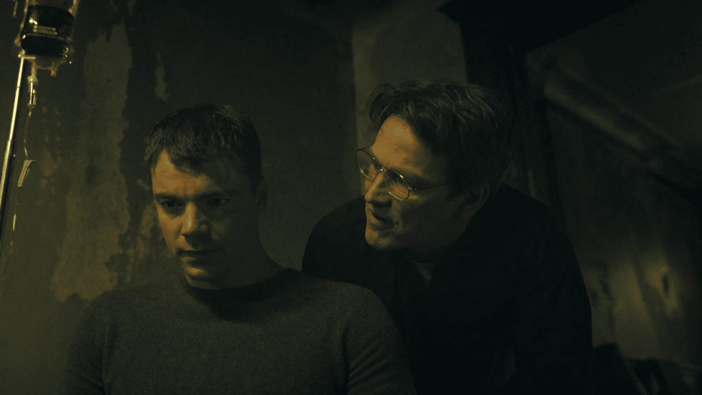 Still from the night agent season 3 featuring Peter Sutherland being interrogated