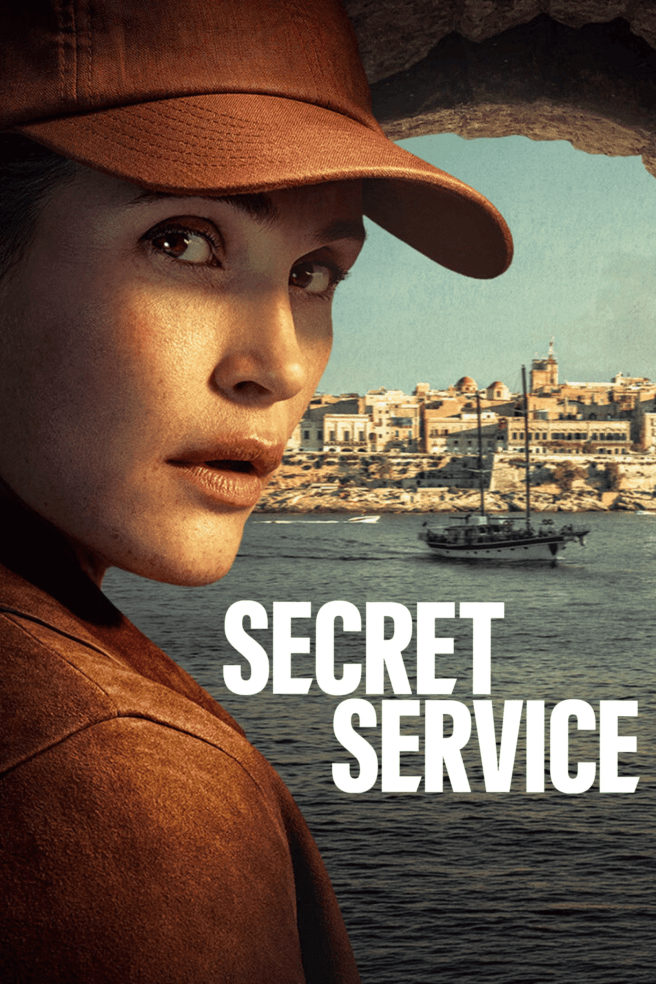 Gemma Aterton on a poster for TV series "SECRET SERVICE" wearing a brown baseball cap looks intently from behind a rocky overhang, with a seaside town and a sailboat visible in the background. White text reads "SECRET SERVICE".