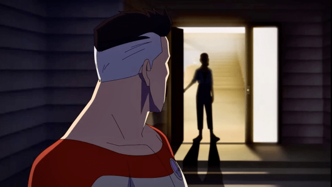 Nolan looking back towards an open doorway where a silhouetted Debbie Grayson stands in front of a sunlit staircase.