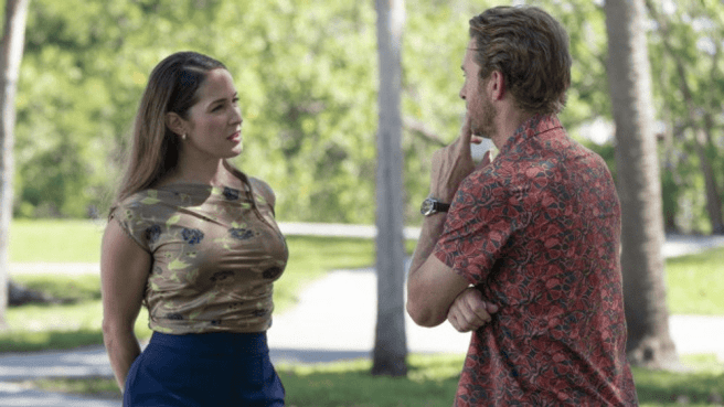 Jaina Lee Ortiz as Emi in RJ Decker season 1, looking away from Scott Speedman
