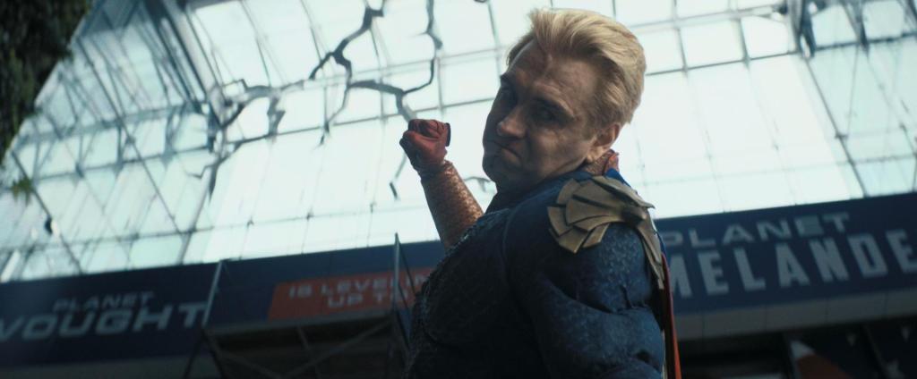 Antony Starr as Homelander in his superhero costume with his fist raised in The Boys season 5.